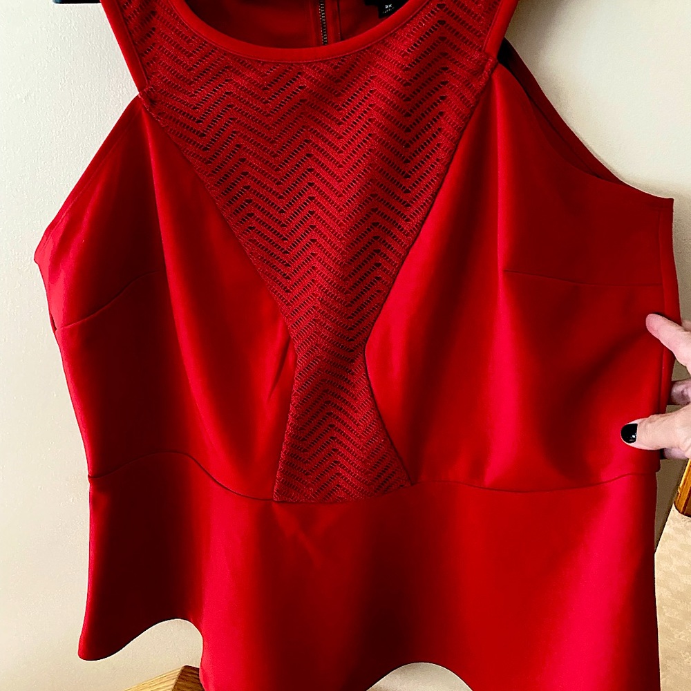 Pretty Peplum style sleeveless knit top.